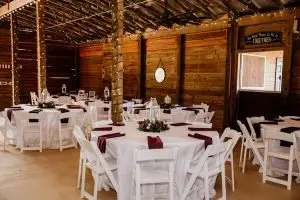 dining table setup in the barn at Kelly Farms wedding venue in St. Augustine, FL